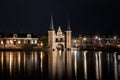 The famous historical `Waterpoort` in the city of Sneek at night with reflections in the canal - Sneek, Friesland, The Netherlan