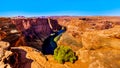 The famous Horseshoe Bend of the Colorado River in the semi desert landscape near Page, Arizona Royalty Free Stock Photo