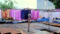 Dhobi Ghat - huge open air laundy with modern buildings on background. Mumbai, India. View from the roof.