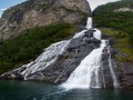 The famous and impressive waterfall The Suitor Friaren dropping down the rocks into the Geiranger Fjord