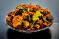 Famous Indian & Gujarati snack dish in a glass plate on wooden surface i.e. Patra or paatra consisting of mainly Colocasia Royalty Free Stock Photo