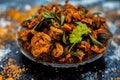 Famous Indian & Gujarati snack dish in a glass plate on wooden surface i.e. Patra or paatra consisting of mainly Colocasia Royalty Free Stock Photo