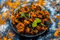 Famous Indian & Gujarati snack dish in a glass plate on wooden surface i.e. Patra or paatra consisting of mainly Colocasia Royalty Free Stock Photo