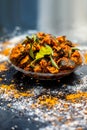 Famous Indian & Gujarati snack dish in a glass plate on wooden surface i.e. Patra or paatra consisting of mainly Colocasia Royalty Free Stock Photo