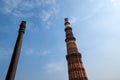 Famous Iron Pillar with the Qutub Minar minaret columb in New Delhi, India, located In the courtyard of the QuwwatuÃ¢â¬â¢l-Islam Royalty Free Stock Photo