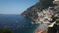 The famous Italian city on the cliff and the sea view with yachts, boats and tourists