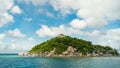 Scenic view tropical paradise with peaceful resort, rocky coastline, clear turquoise sea with coral reef against cloud sky. Koh Royalty Free Stock Photo