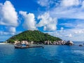 Scenic view tropical paradise with peaceful resort, rocky coastline, clear turquoise sea with coral reef against cloud sky. Koh Royalty Free Stock Photo