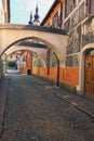 Famous Josef Vachala street. Colorful narrow street with archway and black and white pictures in the wall. Josef Vachala, Litomysl