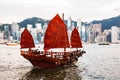 Famous Junk Boat in Victoria Harbour with Hong Kong Island Royalty Free Stock Photo