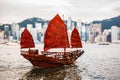 Famous Junk Boat in Victoria Harbour with Hong Kong Island Royalty Free Stock Photo