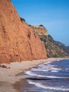 The famous Jurassic Coast red cliffs at Sidmouth, Devon, England. Looking East from Sidmouth Beach to Salcombe Hill Royalty Free Stock Photo