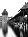 Kappel bridge in Luzern with the water tower vertical view in black and white long exposure