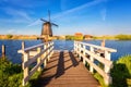 Famous Kinderdijk village of mills, popular tourist attraction in Netherlands Holland, outdoor travel background Royalty Free Stock Photo