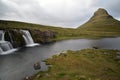 Famous kirkjufell mountain with the kirkjufell falls waterfalls in front in Iceland