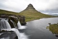 Famous kirkjufell mountain with the kirkjufell falls waterfalls in front in Iceland