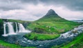 Famous Kirkjufellsfoss waterfall with Kirkjufell mountain, panoramic landscape, Snaefellsnes peninsula, Iceland