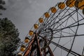 Old ferris wheel in the ghost town of Pripyat. Consequences of the accident at the Chernobil nuclear power plant