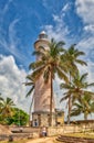 The famous lighthouse in the Galle Fortress with a stunning cloudy sky