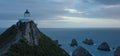 The famous lighthouse and rocks at Nugget Point in the Catlins in the South Island, New Zealand after the sunset Royalty Free Stock Photo