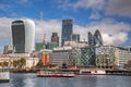 London with modern city architecture against river with boats in England, UK Royalty Free Stock Photo