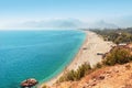long Konyaalti beach in Antalya. Turkish resort and Riviera with the Taurus mountains in the background Royalty Free Stock Photo