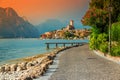 Fantastic Malcesine tourist resort and colorful sunset, Garda lake, Italy Royalty Free Stock Photo