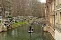 Cambridge, UK: April 2023: Mathematical Bridge, Queens College, Cambridge. Punting under the bridge on the river Cam