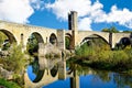 Medieval bridge over the Fluvia river in the medieval village of Besalu, Girona, Catalonia, Spain Royalty Free Stock Photo