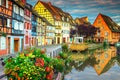 Famous medieval half-timbered facades reflecting in water, Colmar, France Royalty Free Stock Photo