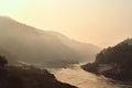 Famous Mekong river during sunrise, with a boat gliding along in Park Being Laos in the morning Royalty Free Stock Photo