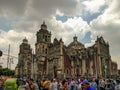 Mexico City Metropolitan Cathedral. Pedestrians bustling by.