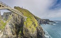 The famous Mizen Head Bridge spanning rocky cliffs above the Atlantic Ocean in Ireland Royalty Free Stock Photo