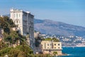 Famous Monaco oceanographic museum at the board of the ocean and mountains in the background Royalty Free Stock Photo