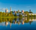 The famous Moscow landmark with Golden domes and a reflection of the landscape on the water of the Park pond against the