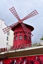 Famous Moulin Rouge cabaret located at Pigalle district close to Montmartre. Red windmill close-up. Paris, France. Royalty Free Stock Photo
