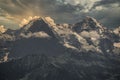Famous mountains Eiger and Monch surrounded by clouds. Royalty Free Stock Photo
