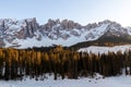 The famous mountains latemar in south tyrol, italy, with the frozen lake karersee in the front Royalty Free Stock Photo