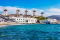 The iconic Mykonos windmills in front of the blu sea Royalty Free Stock Photo