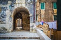 Famous narrow street and old city walls in Dubrovnik, Croatia