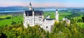 Famous Neuschwanstein Castle, fairy-tale palace on a rugged hill above the village of Hohenschwangau near Fussen Royalty Free Stock Photo