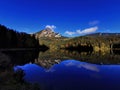 Deep blue Swiss lake mirroring mountain Royalty Free Stock Photo