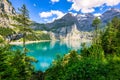 Famous Oeschinensee with Bluemlisalp mountain on a sunny summer day. Panorama of the azure lake Oeschinensee. Swiss alps, Royalty Free Stock Photo