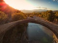 The famous old stoned bridge of Konitsa over Aoos river. Tymfi mount, Zagori, Epirus, Greece, Europe Royalty Free Stock Photo