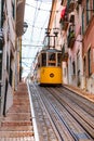 Famous old yellow funicular tram on street of Lisbon, Royalty Free Stock Photo