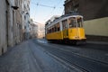 The famous old yellow tram 28 passing on street in Lisbon, Portugal Royalty Free Stock Photo