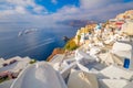 The famous panoramic view of the sights of Santorini - white houses, blue domes and yachts in the azure sea. Oia, Santorini island Royalty Free Stock Photo