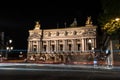 Famous Paris Opera at Night, lights of the traffic leading around Royalty Free Stock Photo