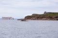The famous PercÃÂ© rock and the Bonaventure Island surrounded by cormorants, seagulls and grey seals