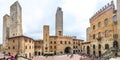 Famous Piazza del Duomo in the historic town of San Gimignano on a sunny day, Tuscany, Italy